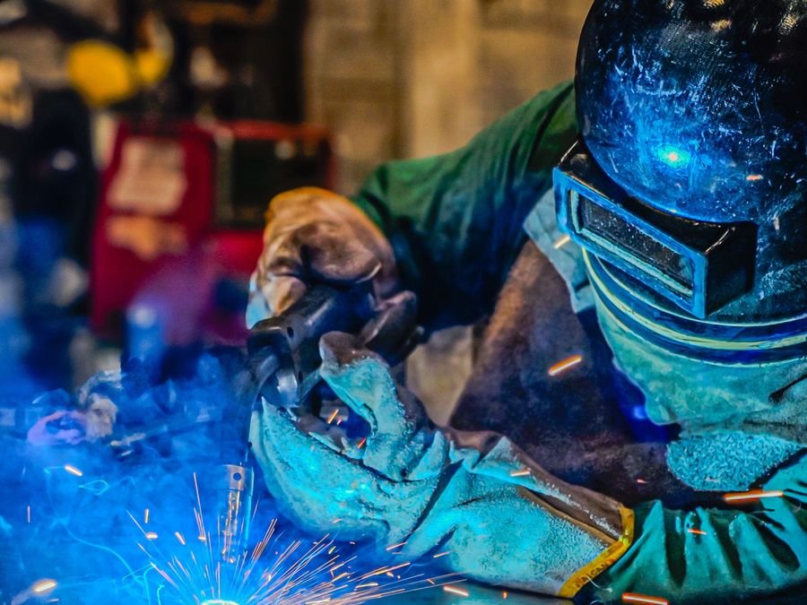 Welder joining a steel assembly at the AV FAB.TECH fabrication workshop