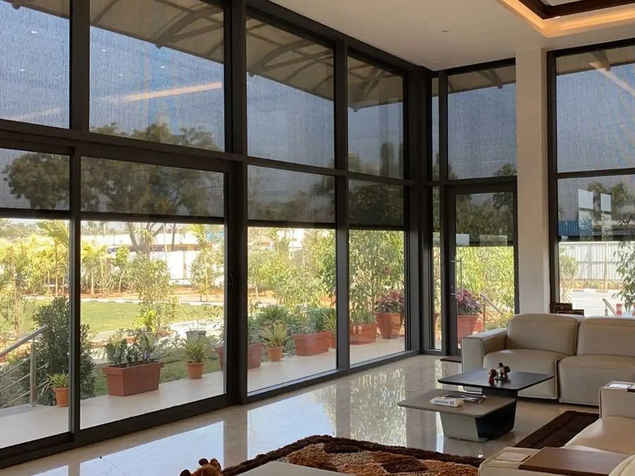 Insect mesh screen fitted across a large glazed opening