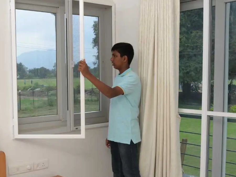 Mosquito mesh shutter fitted to a window inside a bedroom