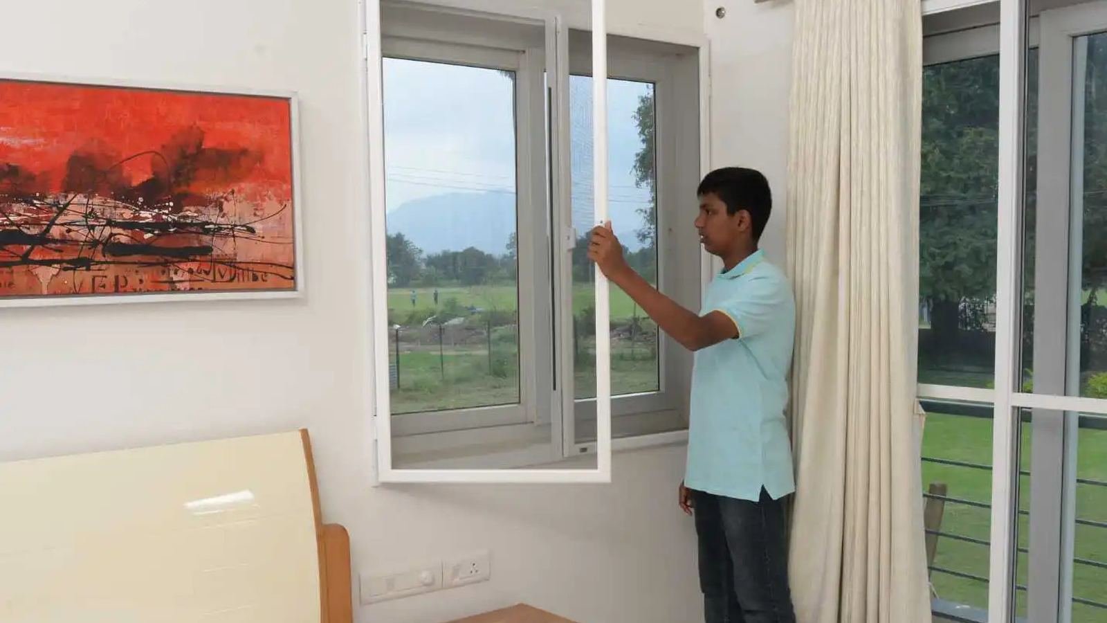 Openable mosquito mesh shutter being fitted to a window frame