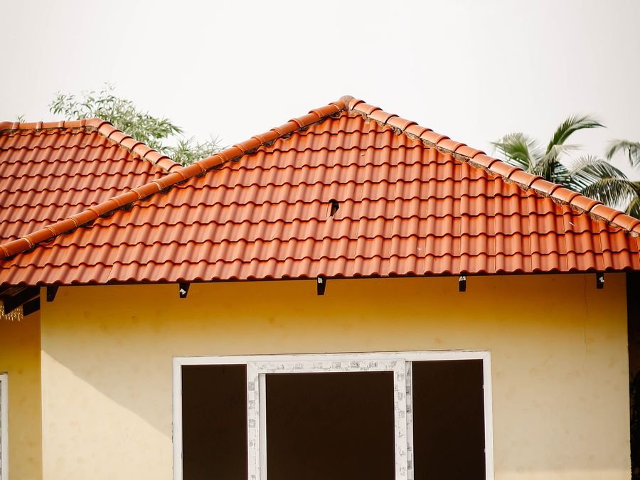 uPVC sliding window fitted in a completed house with tiled roof